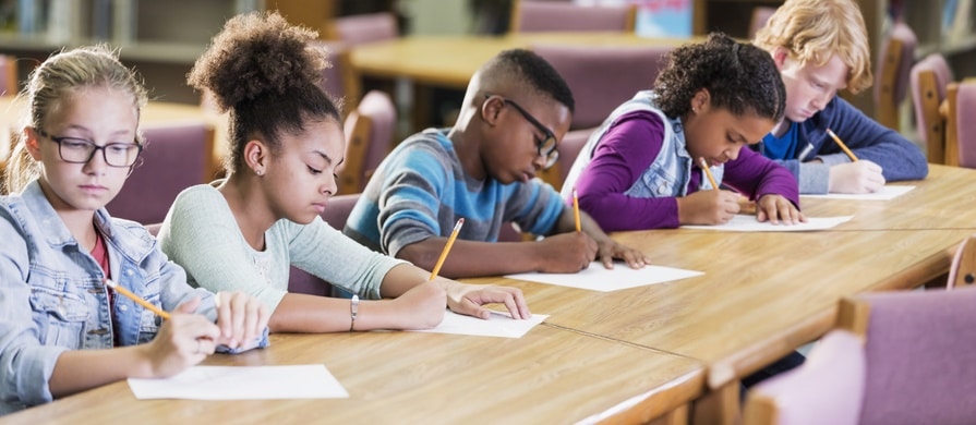 Elementary school students taking a test